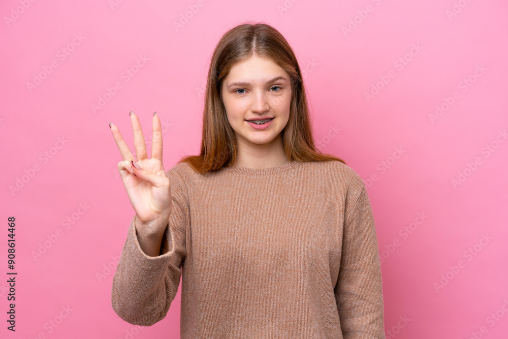 Teenager Russian girl isolated on pink background happy and counting three with fingers Teenager Russian girl isolated on pink background happy and counting three with fingers