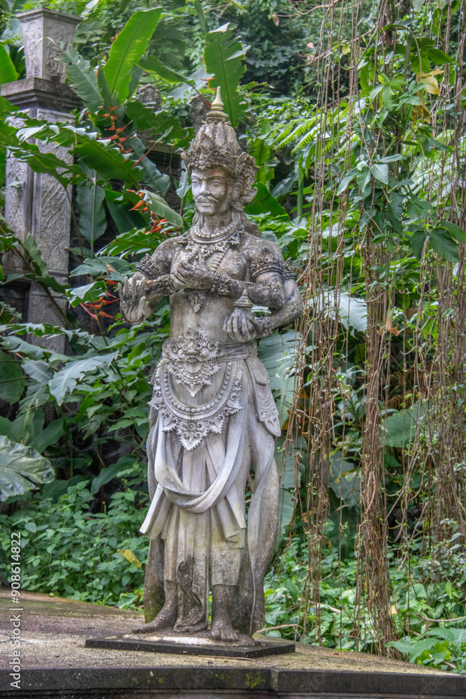the king's water temple or water palace. Tropical landscape, colorful flowers and statues can be found on the Tirta Gangga site, Bali, Indonesia the king's water temple or water palace. Tropical landscape, colorful flowers and statues can be found on the Tirta Gangga site, Bali, Indonesia