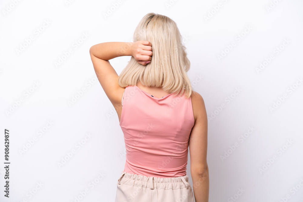 Young Russian woman isolated on white background in back position and thinking Young Russian woman isolated on white background in back position and thinking