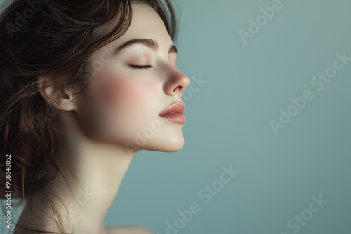 A close up of a girl's face with her eyes closed