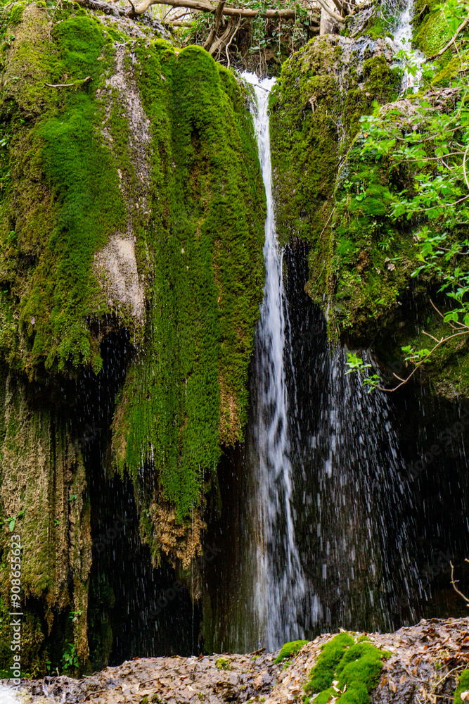Obraz premium Serene waterfall cascading through mossy cliffs at Beli Izvorac, Serbia