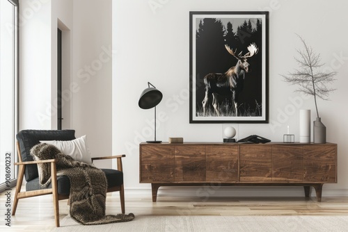 Modern living room with a stylish armchair and a moose artwork on the wall photo