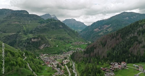 Bird Eye View of Rocca Pietore, Italy Quaint Tourist Town Nestled on the Slopes of the Dolomites. High quality 4k footage photo