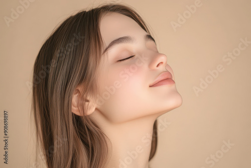 A close up of a girl's face with her eyes closed