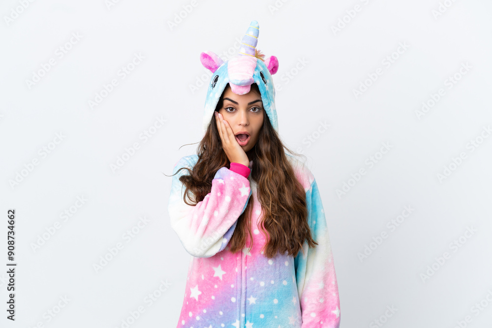 Young caucasian woman wearing a unicorn pajama isolated on white background with surprise and shocked facial expression Young caucasian woman wearing a unicorn pajama isolated on white background with surprise and shocked facial expression