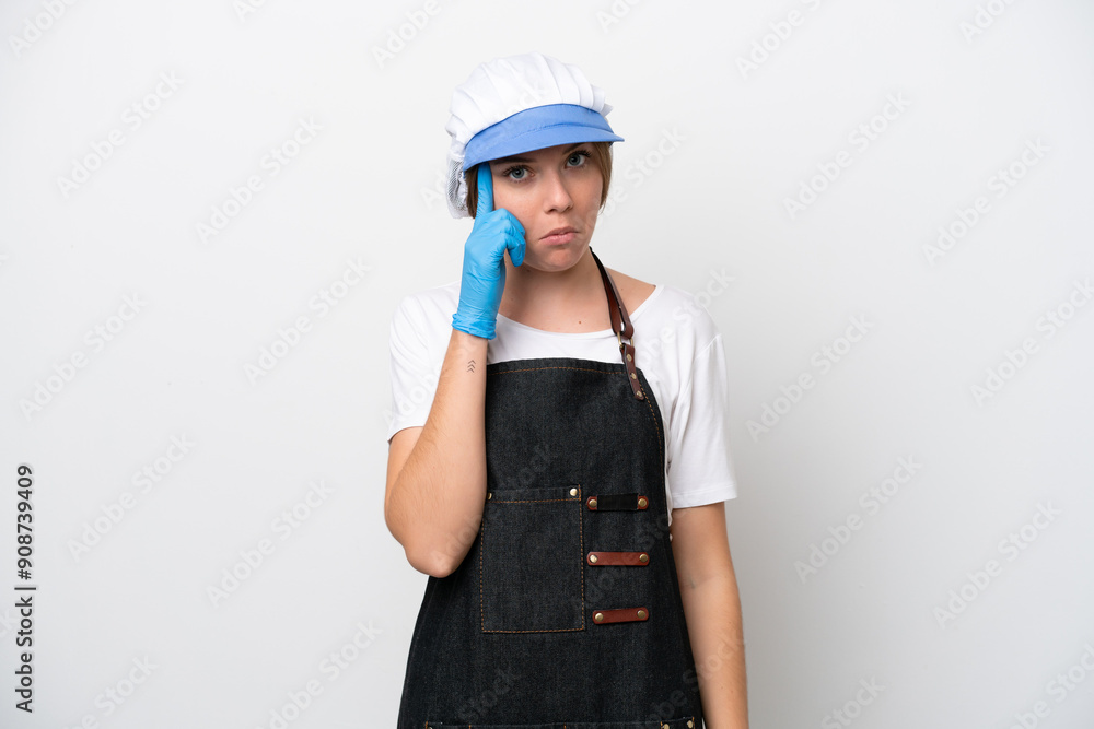 Fishmonger woman wearing an apron thinking an idea Fishmonger woman wearing an apron thinking an idea