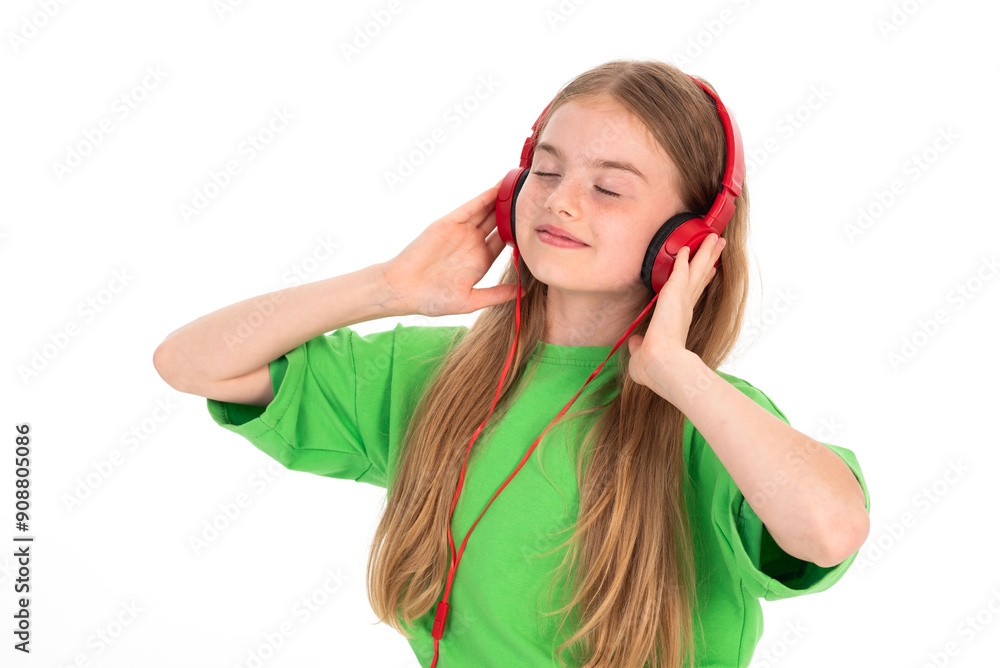 Happy girl in green summer outfit dancing enjoying music in red headphones on white background Happy girl in green summer outfit dancing enjoying music in red headphones on white background