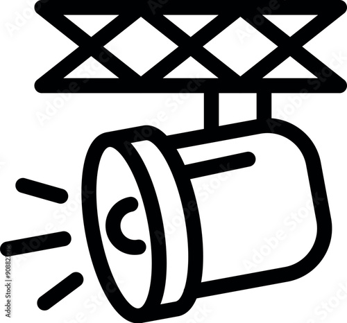 Stage spotlight is hanging on a metal truss and giving bright light