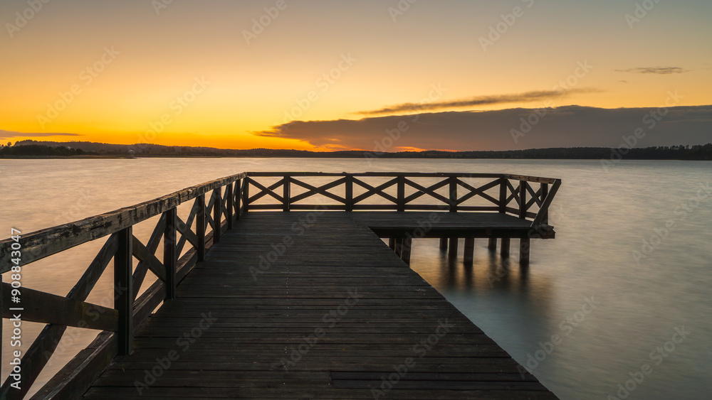 Fototapeta premium Summer vacation at the lake. Sunset in Masuria. Pier at sunset