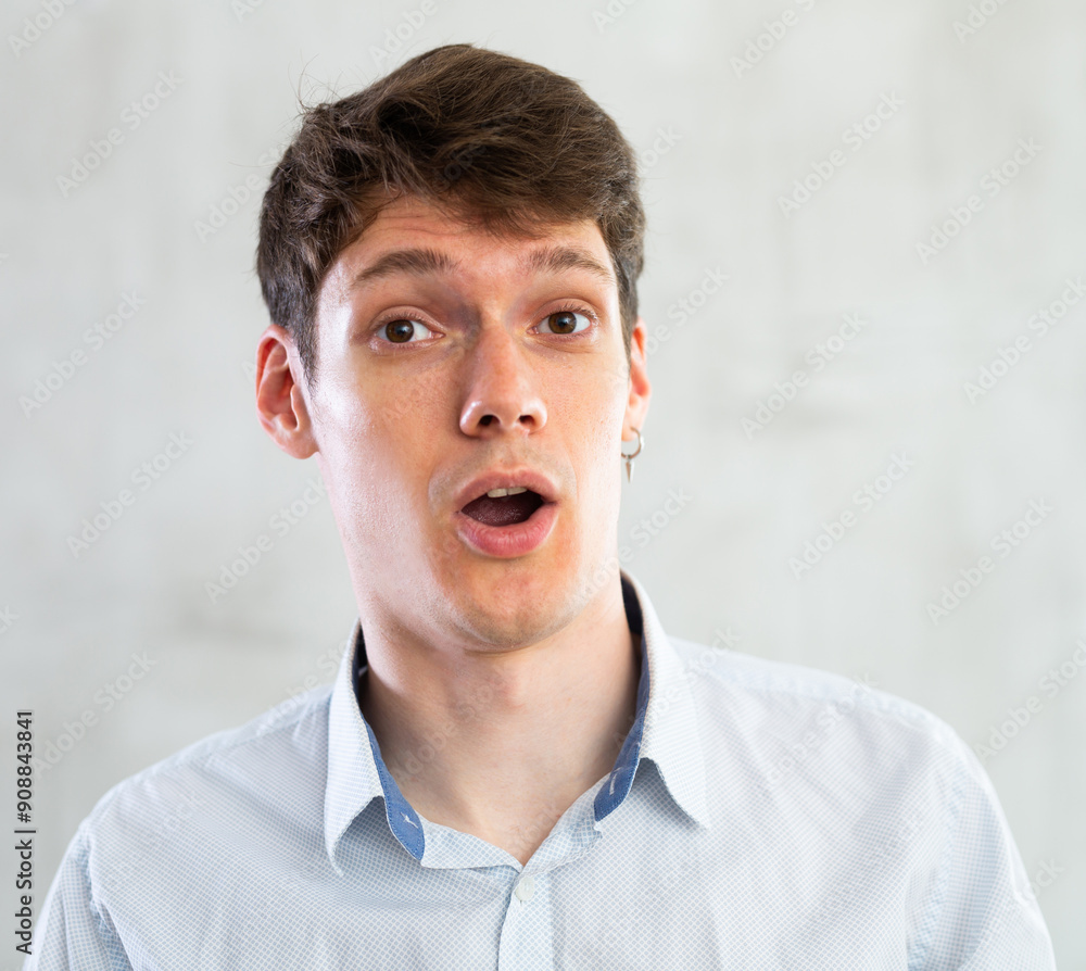 Emotions, people and positive concept man expresses different on gray background Emotions, people and positive concept man expresses different on gray background
