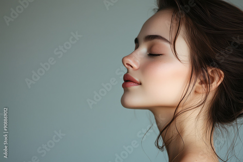 A close up of a girl's face with her eyes closed