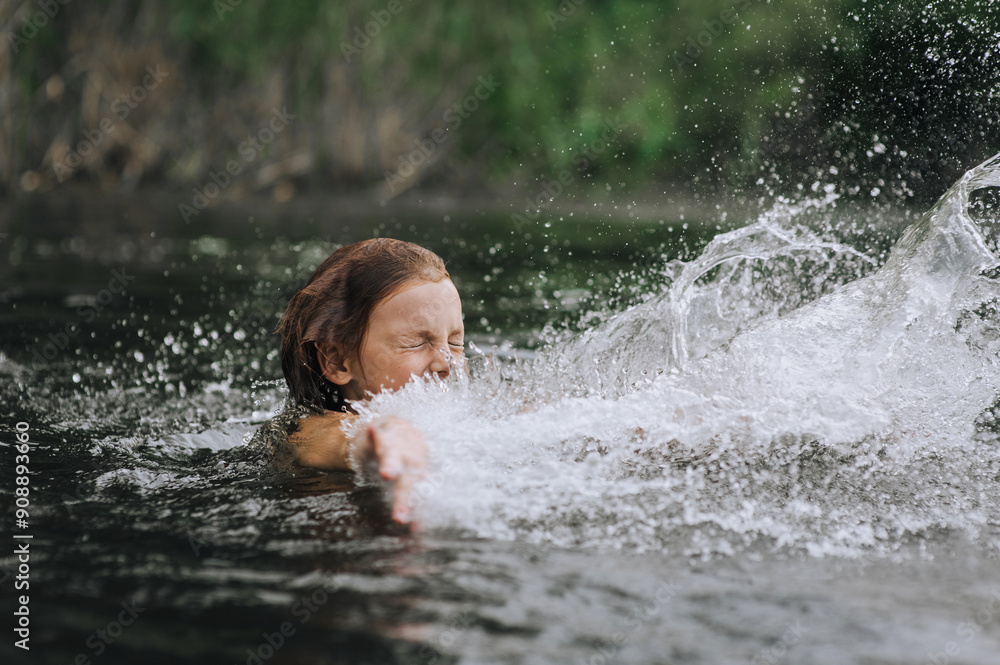 Obraz premium Little happy girl, smiling child jumping, having fun, laughing, spinning, swimming in water on the sea, in the lake. Photo, portrait.