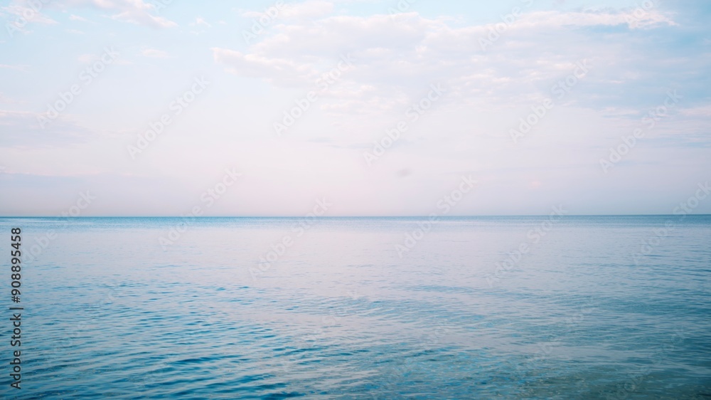 Seascape. Purple minimalist landscape. Calm sea. Horizon. Clear horizon. Clouds in the sky. Sunset. Pink colors Seascape. Purple minimalist landscape. Calm sea. Horizon. Clear horizon. Clouds in the sky. Sunset. Pink colors