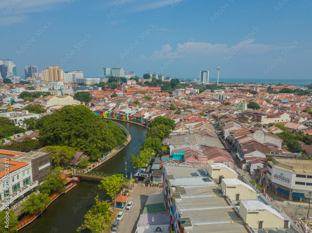 Aerial drone view of big and dense Malacca City with Malaysian settlements at Melaka, Malaysia. Aerial drone view of big and dense Malacca City with Malaysian settlements at Melaka, Malaysia.