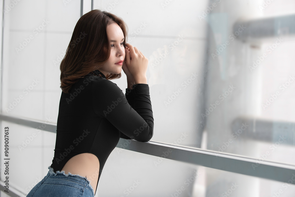 side view portrait of thoughtful woman look outside through window.