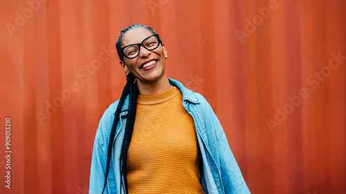 Fotografie Smiling mature woman in colorful outfit, happy and confident