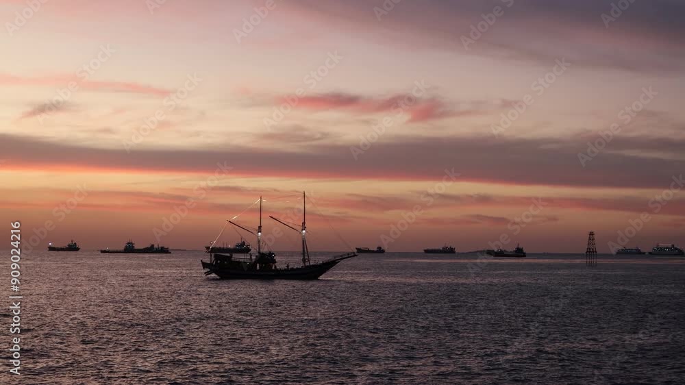 A phinisi boat sails in the afternoon A phinisi boat sails in the afternoon