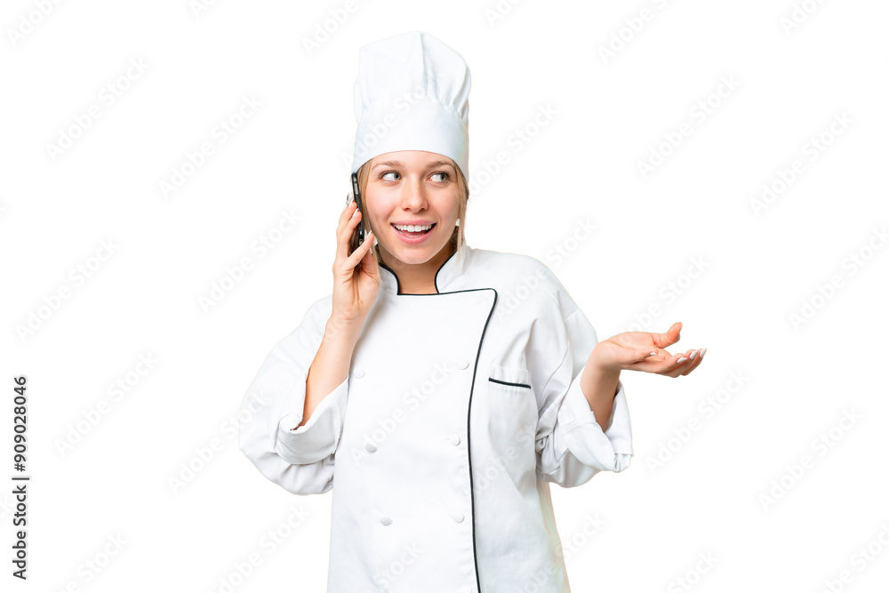 Young chef woman over isolated chroma key background keeping a conversation with the mobile phone with someone Young chef woman over isolated chroma key background keeping a conversation with the mobile phone with someone