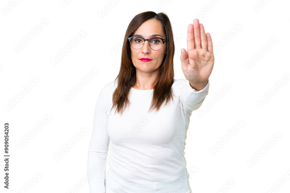 Middle age woman over isolated chroma key background making stop gesture Middle age woman over isolated chroma key background making stop gesture