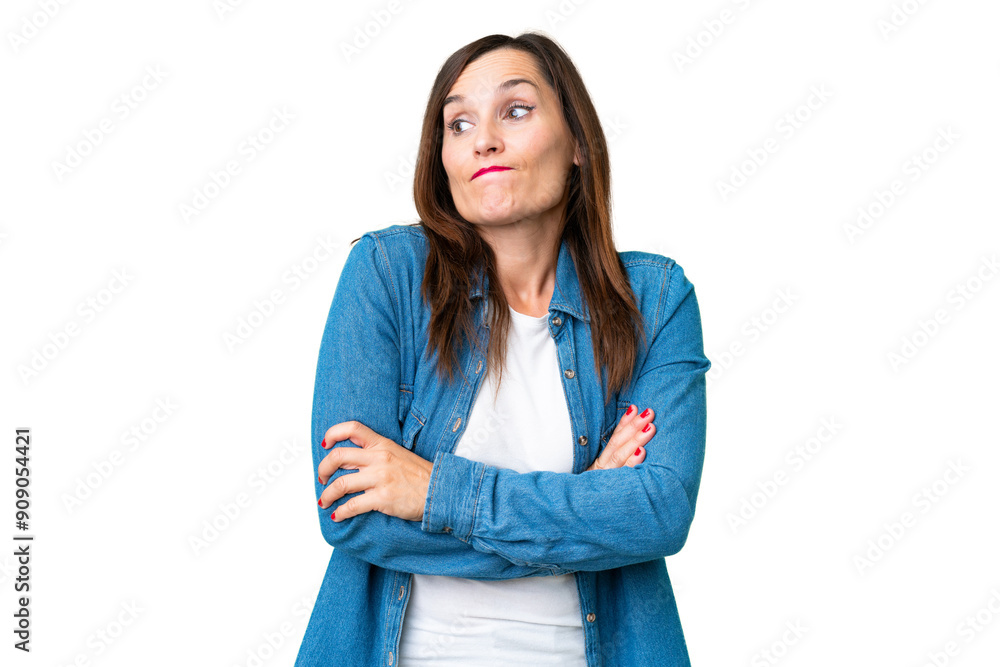 Middle age woman over isolated chroma key background making doubts gesture while lifting the shoulders Middle age woman over isolated chroma key background making doubts gesture while lifting the shoulders