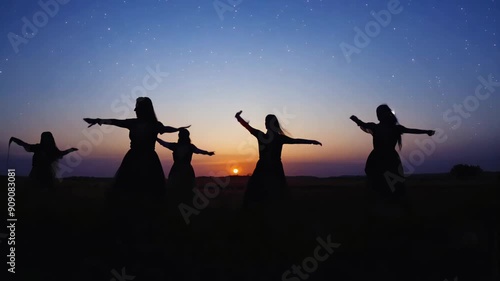 Summer Solstice Celebration with Women in Flower Crowns and Dresses in a Sunlit Field. photo