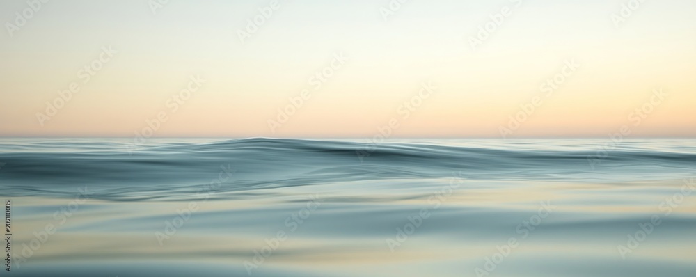 Calm ocean at sunrise with subtle waves, serene natural seascape. Tranquility and peace concept Calm ocean at sunrise with subtle waves, serene natural seascape. Tranquility and peace concept
