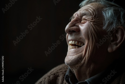Joyful elderly man laughing wrinkles accentuated, with copy space
