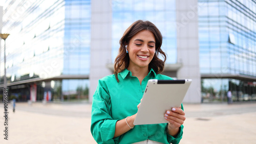 Female entrepreneur using a tablet in the city