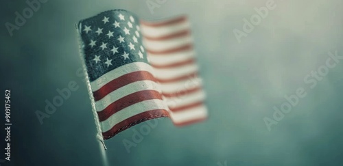 American Flag Waving in Front of a Crowd During a Dusk Gathering