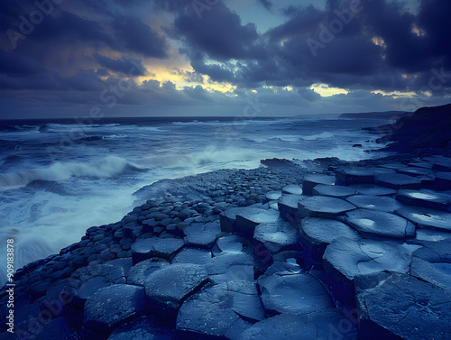 Unique rock formations on coastal cliffs, with crashing waves, in Northern Ireland's Giants Causeway. photo