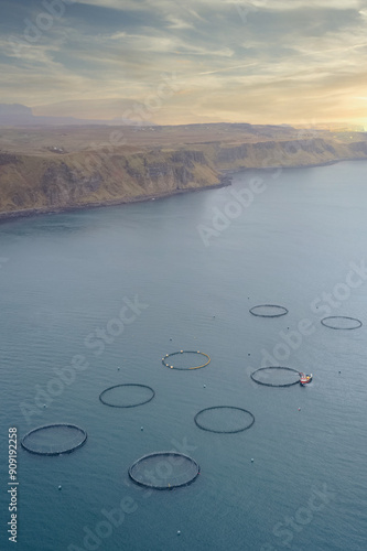 Fish farm nets in ocean at the Isle of Skye in Scotland photo