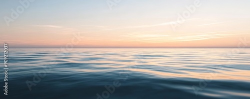 Calm ocean surface at sunset, tranquil and serene sea view. Nature and relaxation concept