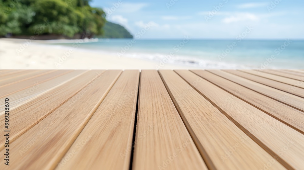 Fototapeta premium Peaceful beach scene with clear blue water, seen from the perspective of a wooden deck 
