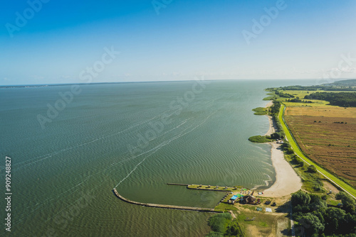 View from a drone of the Vistula Lagoon on a warm summer day. View from the town of Kadyny. Poland.