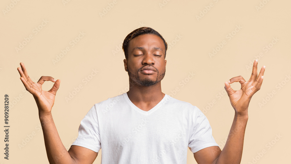 Zen. Relaxed Black Man Meditating Standing Over Yellow Background In Studio. Panorama Zen. Relaxed Black Man Meditating Standing Over Yellow Background In Studio. Panorama