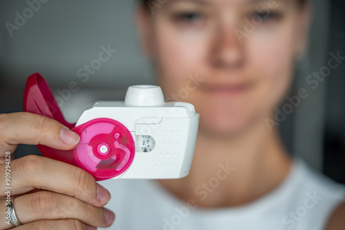 Tableau sur toile Close up view of woman holding medicine dry powder inhaler for treatment asthma or COPD diseases