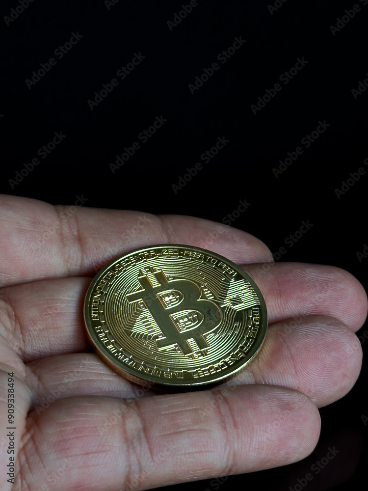 gold bitcoin on dark background, Close up of a shiny Bitcoin BTC Cryptocurrency Coin on a black background. Stock Market Concept. gold bitcoin on dark background, Close up of a shiny Bitcoin BTC Cryptocurrency Coin on a black background. Stock Market Concept.