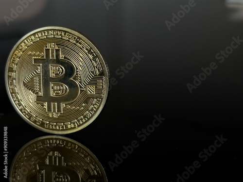 gold bitcoin on dark background, Close up of a shiny Bitcoin BTC Cryptocurrency Coin on a black background. Stock Market Concept.