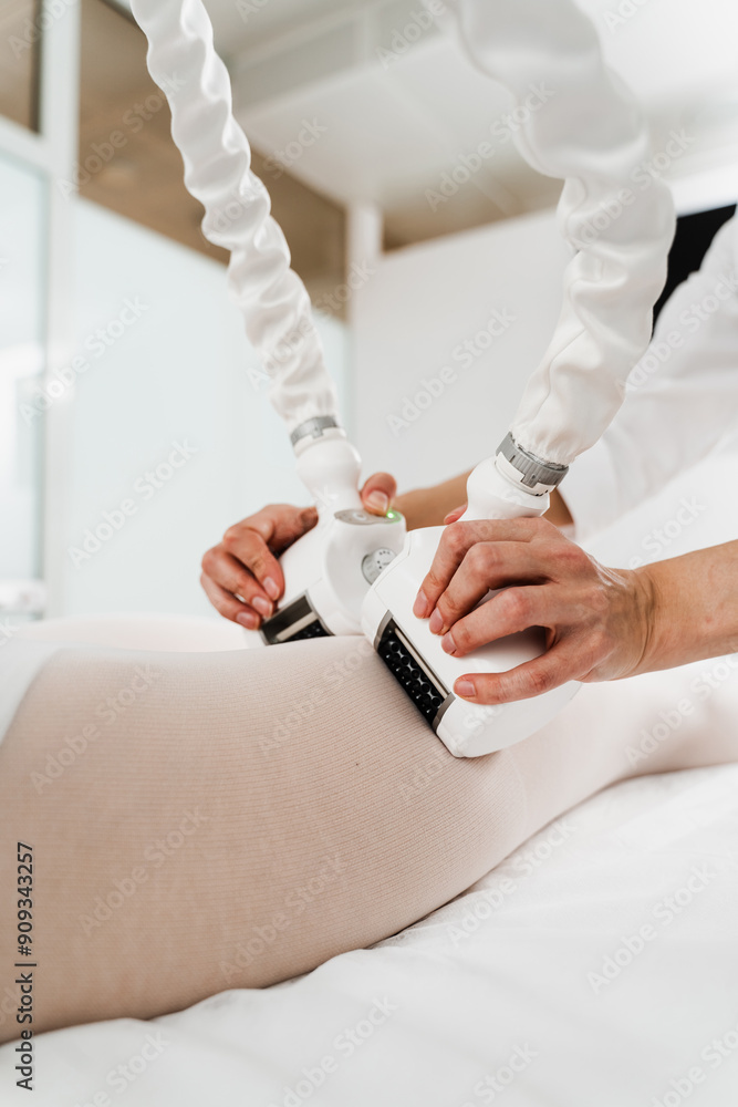 Targeting lymphatic system with rhythmic movements and massage to get rid of waste and toxins. Young woman is having lymphatic drainage treatment to remove leg swelling. Targeting lymphatic system with rhythmic movements and massage to get rid of waste and toxins. Young woman is having lymphatic drainage treatment to remove leg swelling.