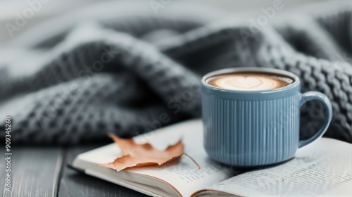 Cozy Autumn Moment With Hot Beverage, Knitted Blanket, and Leaves on a Table