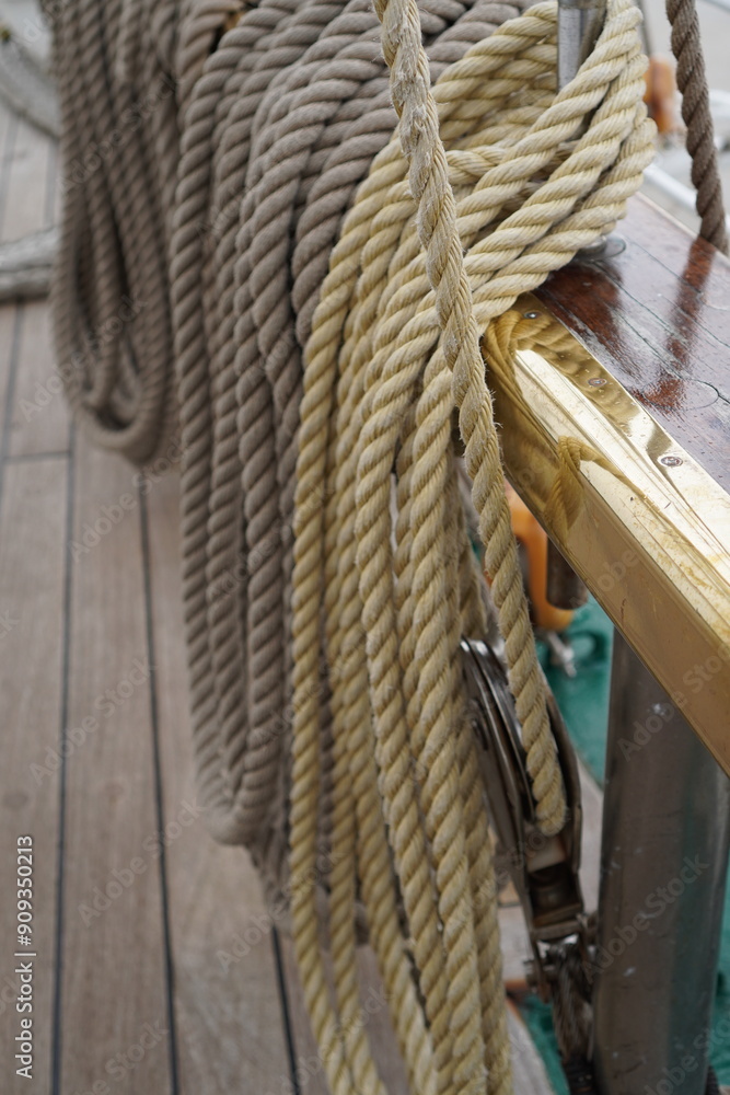 Close up of many ropes coiled up on board of a sailing tall ship Close up of many ropes coiled up on board of a sailing tall ship