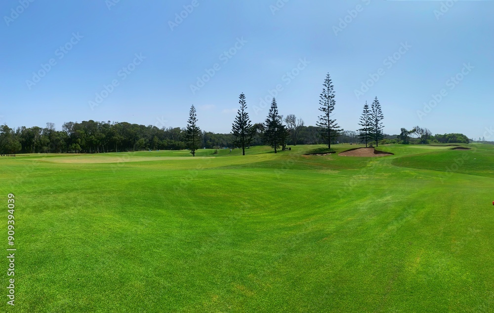 Panorama view of Golf Course with fairway field. Golf course with a rich green turf beautiful scenery. Panorama view of Golf Course with fairway field. Golf course with a rich green turf beautiful scenery.
