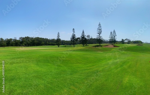 Panorama view of Golf Course with fairway field. Golf course with a rich green turf beautiful scenery.