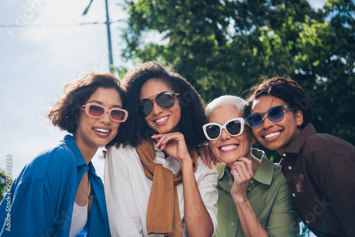 Photo of company friends women toothy beaming smile free time chill walk city park outdoors #909398226