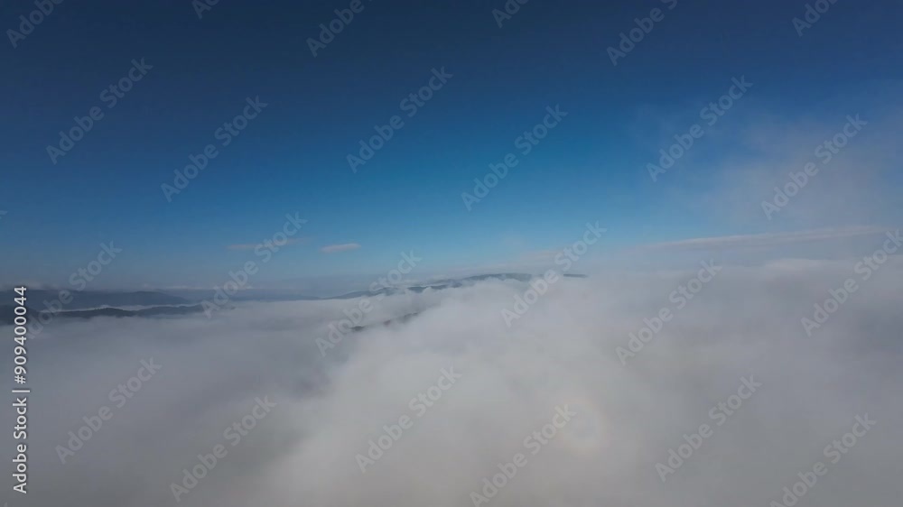 Flying through a gorgeous cloudscape on a fresh summer morning in the mountains Flying through a gorgeous cloudscape on a fresh summer morning in the mountains