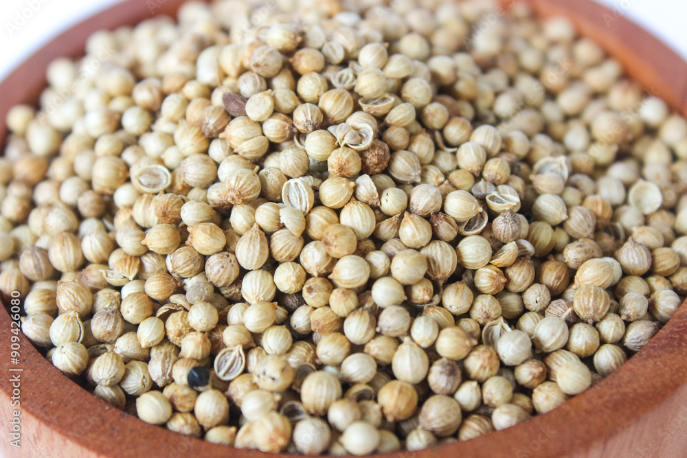 Close up White pepper seeds or Peppercorns in a wooden bowl isolated on white background. Close up White pepper seeds or Peppercorns in a wooden bowl isolated on white background.