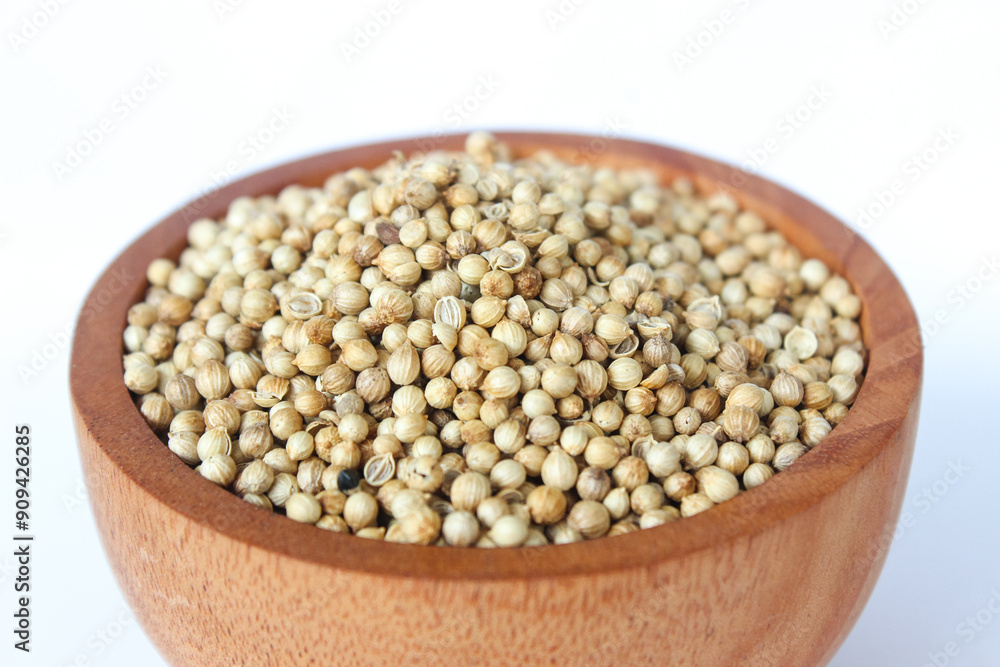 Close up White pepper seeds or Peppercorns in a wooden bowl isolated on white background.
Close up White pepper seeds or Peppercorns in a wooden bowl isolated on white background.