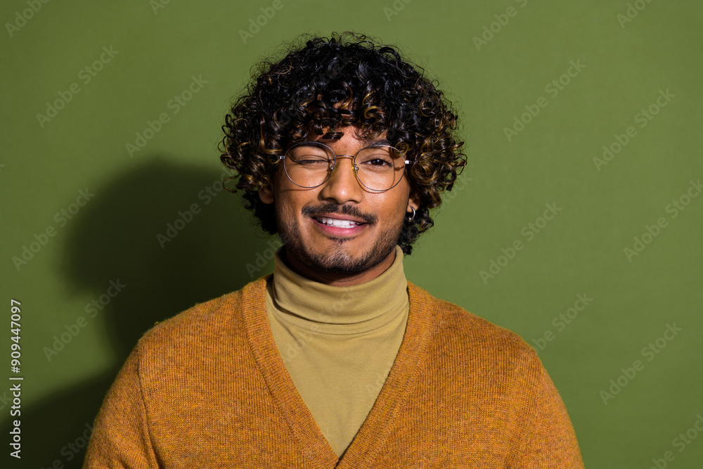 Obraz premium Photo portrait of attractive young man flirty wink dressed stylish brown clothes isolated on khaki color background