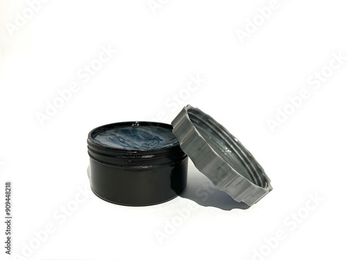 A jar of transparent hair styling pomade cream gel isolated on white background photo