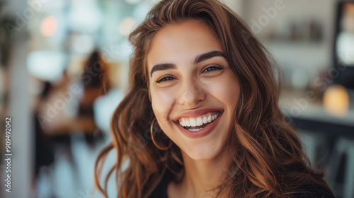 Close up face of young smiling woman with beautiful smile, a big whitening teeth smile..